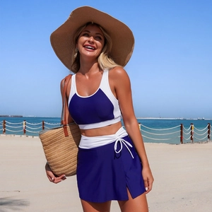 Blue and white two-piece split swimsuit set with skirt detail and drawstring design