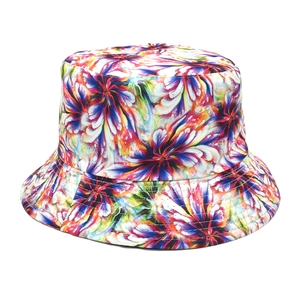 Close-up of tie-dye bucket hat with colorful abstract floral pattern and cotton fabric texture