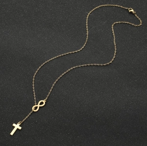 Elegant gold stainless steel infinity cross necklace with lobster clasp on black background