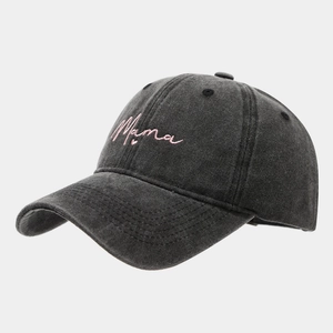 Detailed close-up of pink Mama embroidery and heart on a washed grey baseball cap