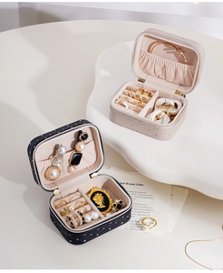 Macro view of portable leather jewelry box with zipper and quilted texture detail