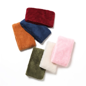 Flat lay of warm coral fleece neck gaiters in various solid colors for winter wear