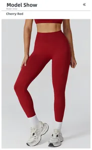 Detail view of cherry red high-waist seamless yoga pants with a body-shaping fit