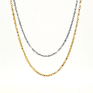 Detail of 18K gold and silver popcorn chain necklaces showing round mesh texture