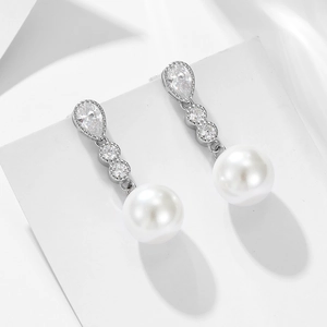 Elegant sterling silver long drop earrings with white pearls and sparkling zircons