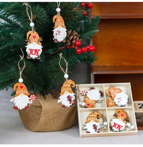 Detailed view of colorful wooden gnome ornaments hanging on a festive Christmas tree branches
