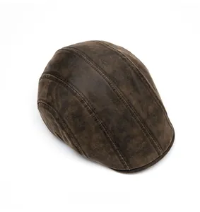 Top view of vintage dark brown flat cap showing weathered texture and stitching detail