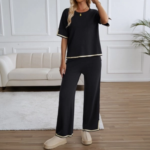 Women's two-piece knit set with short sleeve top and straight trousers in black and beige