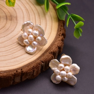 Baroque pearl flower stud earrings with golden base and glossy cream luster finish