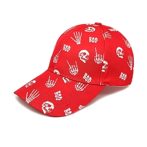 Detail of red cotton baseball cap featuring white skull and BOO graphic print
