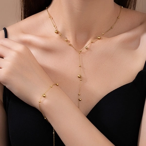 Elegant gold bead necklace and bracelet set in double-layer stainless steel design