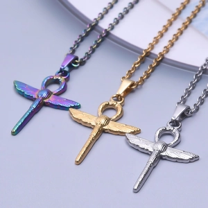 Detailed close-up of three colorful Ankh cross pendants with metallic wings on chain necklaces