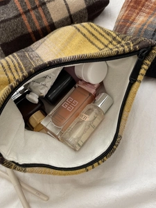 Vintage yellow and grey plaid makeup bag with a zipper closure and large storage capacity
