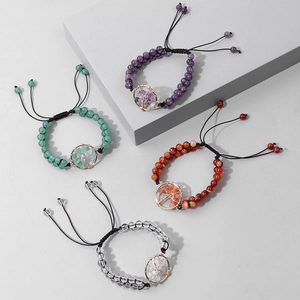 Detail of tree of life charm bracelets with 6mm natural stone beads and braided cord