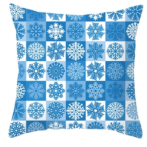 Close-up of blue and white checkered snowflake pattern on a winter square pillowcase