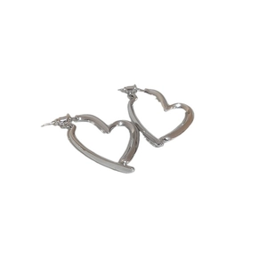 Minimalist silver heart-shaped hoop earrings with a polished metallic finish for women