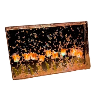 Handmade DIY tulip night light with glowing orange petals in a transparent rectangular frame
