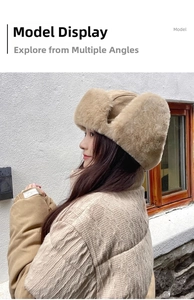 Side view of plush faux fur trapper hat with suede panels and earflaps for winter warmth