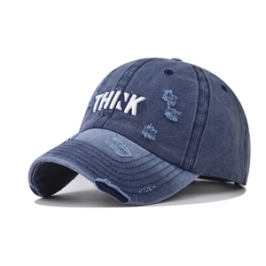 Vintage washed navy baseball cap with white THINK embroidery and distressed details