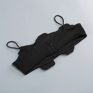 Detail of black crop top showing silver rhinestone trim and hidden back zipper closure