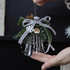 Christmas glass bell ornament with green velvet bow, pine branches and silver glitter