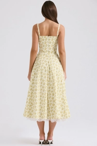 Detail of floral spaghetti strap maxi dress featuring elegant white lace trim at the hem