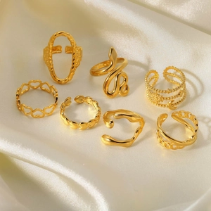 Detailed view of 18K gold plated stainless steel ring set with snake and heart designs