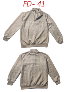 Detailed cable knit texture and 1/4 zipper collar on a beige long sleeve sweater