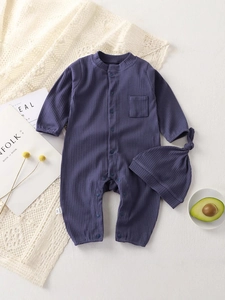 Solid color ribbed baby romper set with matching knotted hat in deep purple cotton fabric
