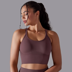 Detail of seamless dark purple sports bra showing ribbed band and knit texture