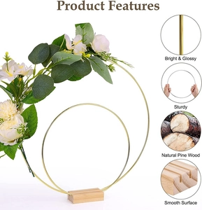 Detail of golden metal floral hoop with natural pine wood base for wedding decoration