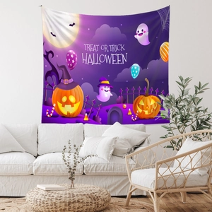 Detail of Halloween tapestry with wizard pumpkin and ghosts over white sofa