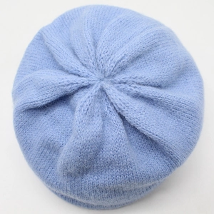 Women's light blue wool blend knit beanie hat featuring thick ribbed texture for winter warmth