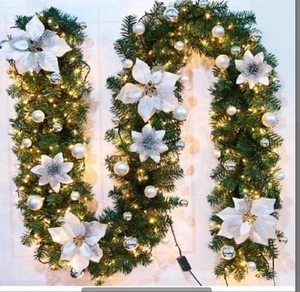 U-shaped Christmas garland with white poinsettia flowers and warm LED lights