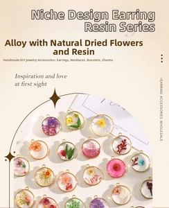 Macro shot of assorted colorful real dried flowers in resin pendants for DIY jewelry making