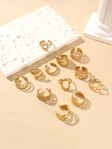 Detailed set of 12 gold plated rings featuring leaf and geometric cutout designs