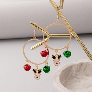 Macro view of Christmas earrings with red bells, green bells and elk pendants
