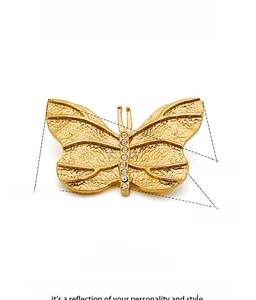 Detail view of a gold butterfly brooch showing precise dimensions and crystal inlay