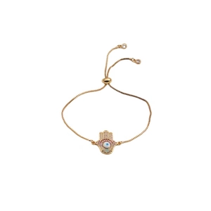 Macro detail of Hamsa Hand and Evil Eye charm with colorful pavé cubic zirconia