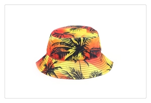 Faux silk bucket hat featuring a vibrant tropical palm tree print in sunset gradient tones.