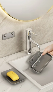 Detail of space aluminum soap dish showing detachable tray and water rinsing process