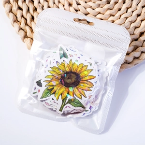Holographic sunflower stickers in clear retail packaging with rainbow laser finish detail