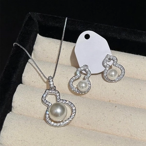Elegant zircon pearl gourd jewelry set including necklace and earrings in a gift box
