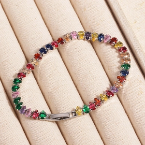 Close-up of rainbow tennis bracelet with pear-cut gemstones and a folding clasp