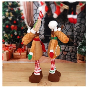 Detail of Christmas reindeer dolls with striped legs in a warm holiday home setting