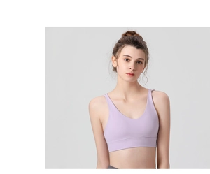 Close-up of lilac V-neck sports bra showing elastic fabric texture and seamless fit
