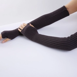 Macro shot of dark brown ribbed knit arm warmers with fingerless design and soft texture