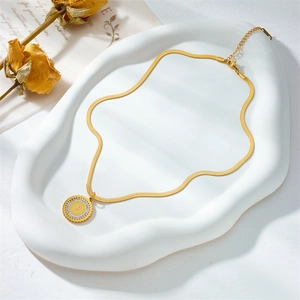 Vintage gold portrait pendant necklace with crystal accents and sleek snake bone chain