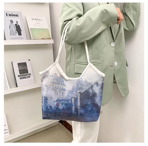 Artistic oil painting canvas tote bag with white shoulder straps shown on model