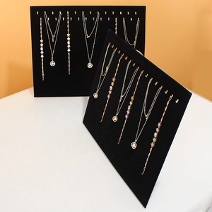 Professional black velvet jewelry display board with metal hooks for necklaces and bracelets